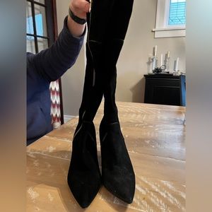 Tall black suede boots with zippers